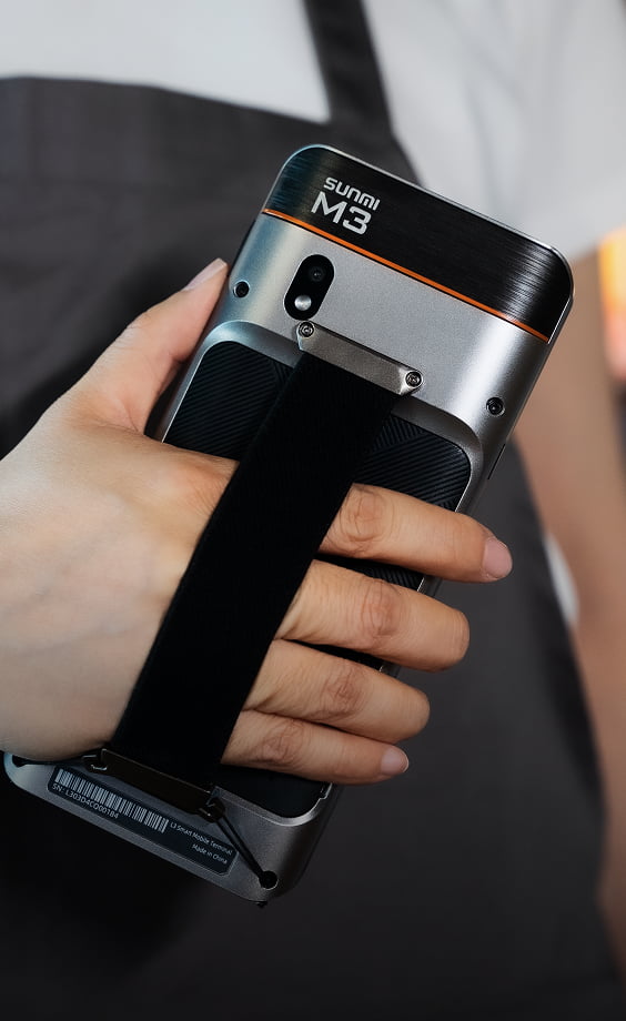 Sunmi M3 held securely with a hand strap accessory