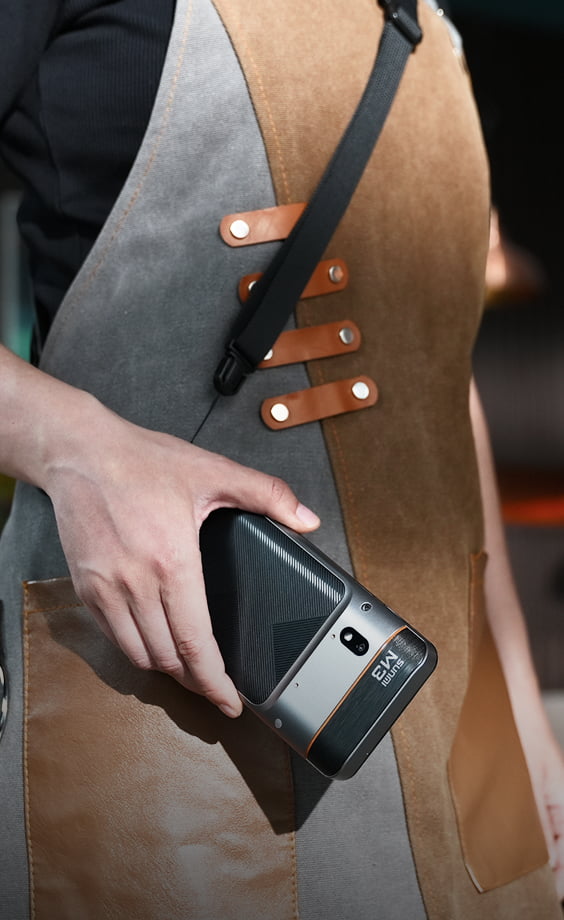 Sunmi M3 worn on a shoulder strap by a member of waitstaff in an apron