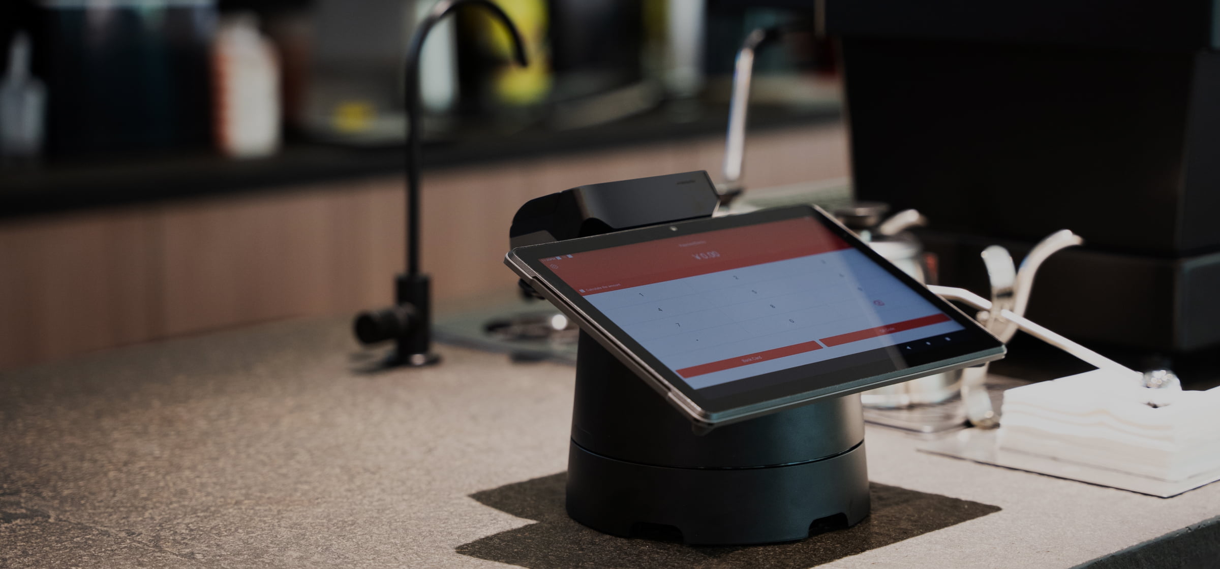 Sunmi V3 MIX docked on a base as a fixed counter POS terminal