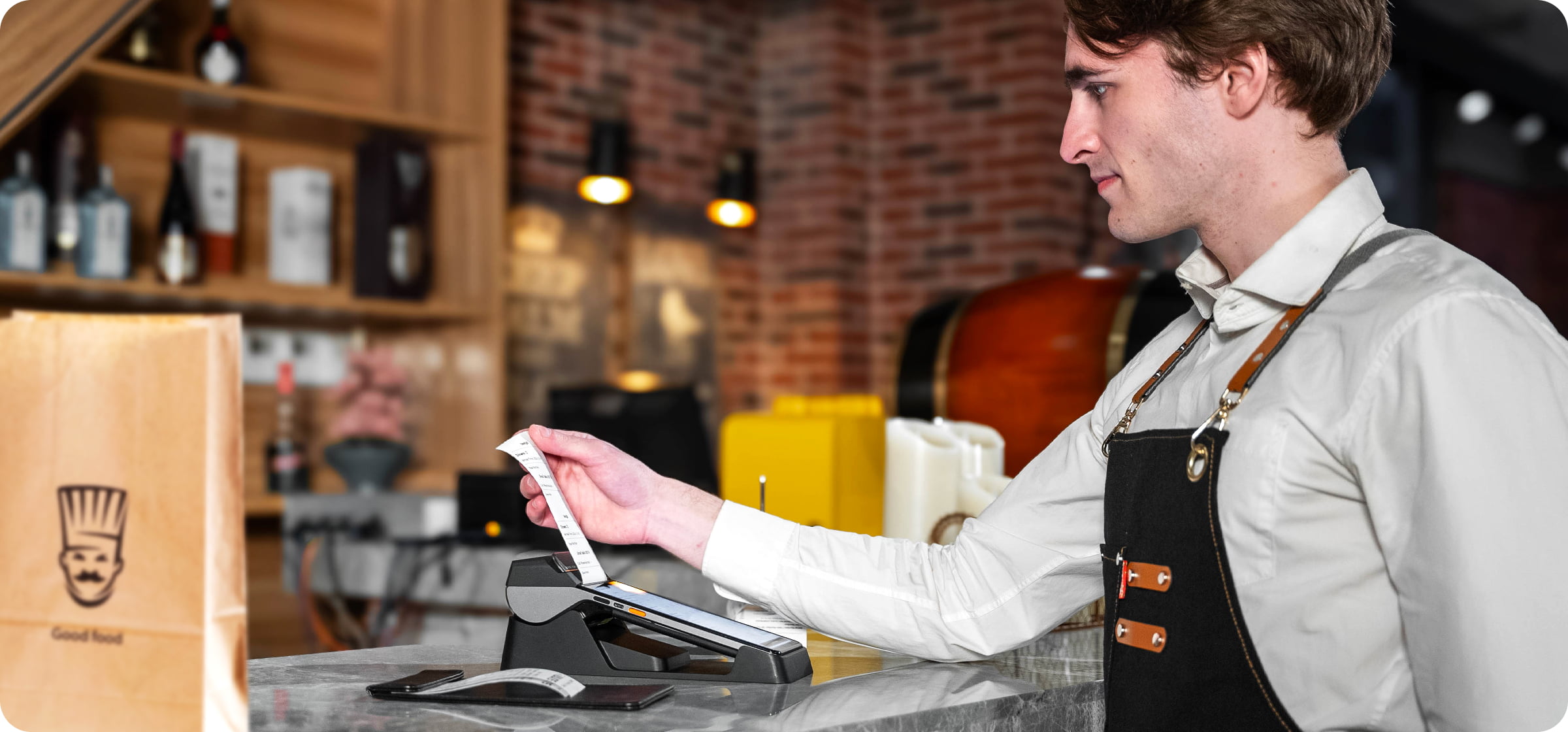 Sunmi V3 docked at a counter printing a receipt for a takeaway order