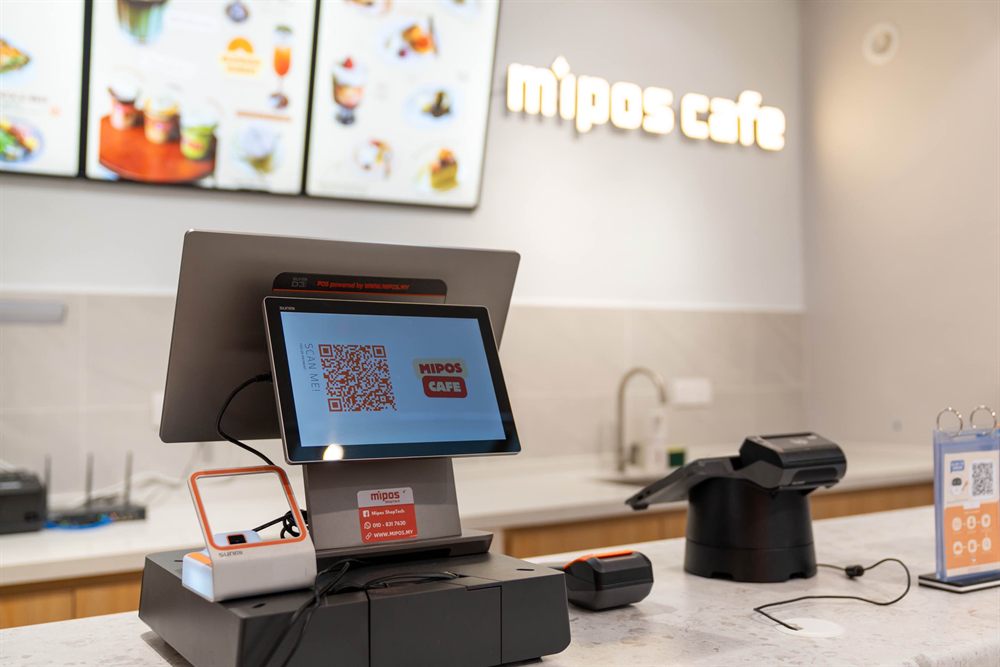 A Sunmi desktop terminal at the Mipos cafe counter